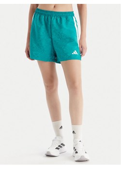 adidas Szorty sportowe Tiro x Common Goal JL9208 Turkusowy Loose Fit ze sklepu MODIVO w kategorii Szorty - zdjęcie 186525570