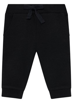 Guess Spodnie dresowe L93Q24 KAUG0 Czarny Regular Fit ze sklepu MODIVO w kategorii Spodnie chłopięce - zdjęcie 186553870