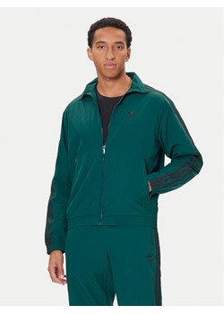adidas Bluza adicolor Woven Firebird JY1329 Zielony Loose Fit ze sklepu MODIVO w kategorii Bluzy męskie - zdjęcie 186642171