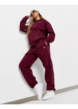 SPODNIE W JORDAN BRKLN FLC PANT 24 - id: FV7077-610 - marki Jordan - 186748223 SPODNIE W JORDAN BRKLN FLC PANT 24 ze sklepu JD Sports  w kategorii Spodnie damskie - zdjęcie 186748223