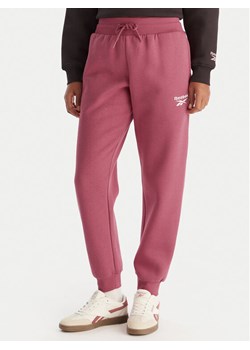 Reebok Spodnie dresowe Erika RK25164CCW Różowy Regular Fit ze sklepu MODIVO w kategorii Spodnie damskie - zdjęcie 186795500