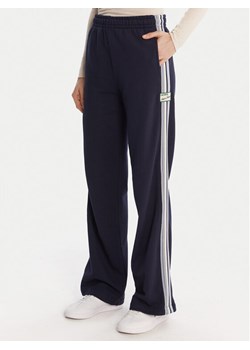 Lacoste Spodnie dresowe XF5250 Granatowy Regular Fit ze sklepu MODIVO w kategorii Spodnie damskie - zdjęcie 186812920