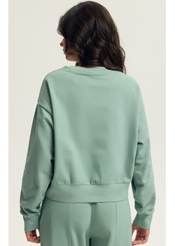 Esotiq bluza damska Bloovii Keithan 43785-07X, Kolor matcha, Rozmiar M, BLOOVII - id: 220905 - marki Bloovii - 187057360 Esotiq bluza damska Bloovii Keithan 43785-07X, Kolor matcha, Rozmiar M, BLOOVII ze sklepu Intymna w kategorii Bluzy damskie - zdjęcie 187057360