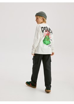 Reserved - Longsleeve Grinch - złamana biel ze sklepu Reserved w kategorii Bluzy chłopięce - zdjęcie 187189224