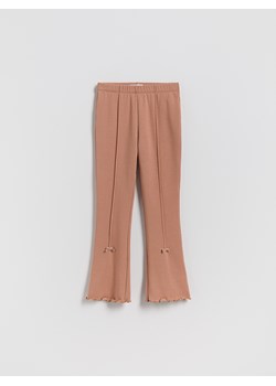 Reserved - Ocieplane legginsy flare z kokardkami - brązowy ze sklepu Reserved w kategorii Spodnie dziewczęce - zdjęcie 187279742