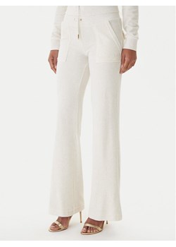 Juicy Couture Spodnie dresowe Layla JCSEBJ001G Beżowy Regular Fit ze sklepu MODIVO w kategorii Spodnie damskie - zdjęcie 187306461