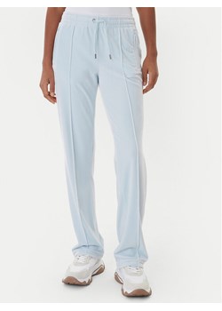 Juicy Couture Spodnie dresowe Tina JCWBJ225307 Błękitny Regular Fit ze sklepu MODIVO w kategorii Spodnie damskie - zdjęcie 187343342