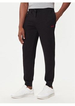 HUGO Spodnie dresowe Austin 50532012 Czarny Regular Fit ze sklepu MODIVO w kategorii Spodnie męskie - zdjęcie 187370920