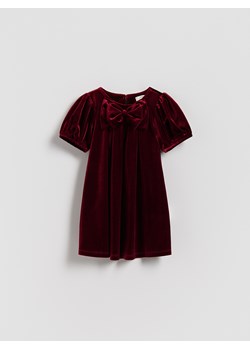 Reserved - Welurowa sukienka z kokardą - czerwony ze sklepu Reserved w kategorii Sukienki dziewczęce - zdjęcie 187381471