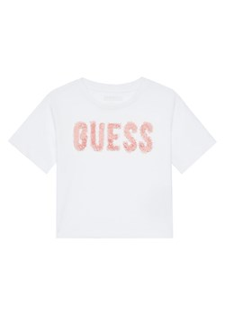 Guess T-Shirt J5YI47 K8HM4 Biały Relaxed Fit ze sklepu MODIVO w kategorii Bluzki dziewczęce - zdjęcie 187606762