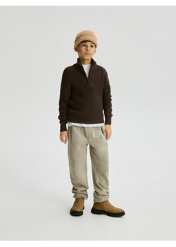 Reserved - Bawełniane spodnie jogger - beżowy ze sklepu Reserved w kategorii Spodnie chłopięce - zdjęcie 187633131