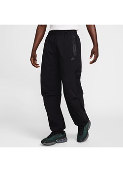 Męskie spodnie oversize z tkaniny Nike Tech - Czerń ze sklepu Nike poland w kategorii Spodnie męskie - zdjęcie 187678191