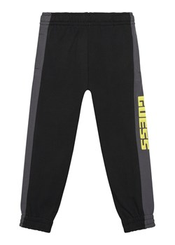 Guess Spodnie dresowe N6RB01 KA6R4 Czarny Regular Fit ze sklepu MODIVO w kategorii Spodnie chłopięce - zdjęcie 187749942