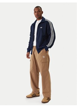 adidas Bluza Firebird KD8313 Granatowy Loose Fit ze sklepu MODIVO w kategorii Bluzy męskie - zdjęcie 187781153