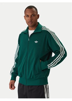 adidas Bluza Firebird KD8314 Zielony Loose Fit ze sklepu MODIVO w kategorii Bluzy męskie - zdjęcie 187783432