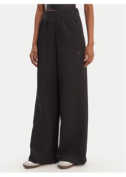 adidas Spodnie dresowe Off Placed 3-Stripes JX2733 Czarny Wide Leg ze sklepu MODIVO w kategorii Spodnie damskie - zdjęcie 187828083