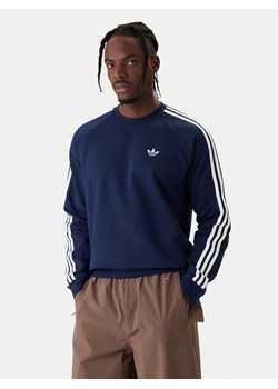 adidas Bluza 3-Stripes KE3549 Granatowy Regular Fit ze sklepu MODIVO w kategorii Bluzy męskie - zdjęcie 187853004