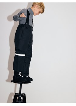 Reserved - Ocieplane spodnie na szelkach - czarny ze sklepu Reserved w kategorii Spodnie chłopięce - zdjęcie 187911010