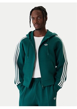 adidas Bluza adicolor Spacer KD4085 Zielony Loose Fit ze sklepu MODIVO w kategorii Bluzy męskie - zdjęcie 187917694
