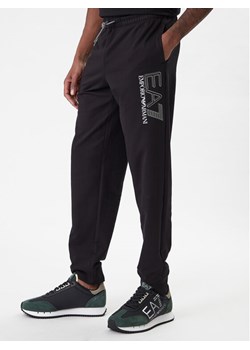 EA7 Emporio Armani Spodnie dresowe 7M001316 AF13512 UC001 Czarny Regular Fit ze sklepu MODIVO w kategorii Spodnie męskie - zdjęcie 187934141
