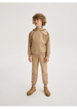 Reserved - Dresowe spodnie jogger - beżowy ze sklepu Reserved w kategorii Spodnie chłopięce - zdjęcie 187957504