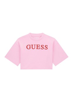Guess T-Shirt J6RI11 KCNQ4 Różowy Oversize ze sklepu MODIVO w kategorii Bluzki dziewczęce - zdjęcie 187966770
