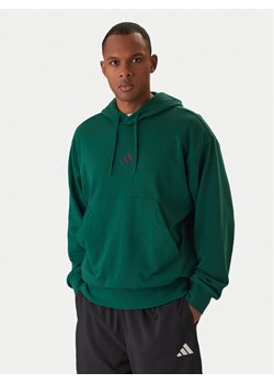 adidas Bluza Essentials Feel Cozy JE3841 Zielony Regular Fit ze sklepu MODIVO w kategorii Bluzy męskie - zdjęcie 187971223