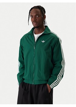 adidas Bluza Firebird KC8018 Zielony Regular Fit ze sklepu MODIVO w kategorii Bluzy męskie - zdjęcie 187971411
