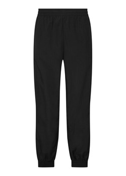 adidas Spodnie dresowe Firebird Woven KE1371 Czarny Regular Fit ze sklepu MODIVO w kategorii Spodnie męskie - zdjęcie 187992600