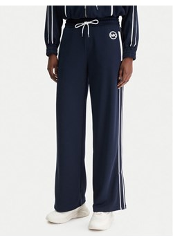 MICHAEL Michael Kors Spodnie dresowe MR630Y0K8N Granatowy Regular Fit ze sklepu MODIVO w kategorii Spodnie damskie - zdjęcie 188007631