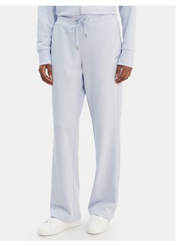 DKNY Sport Spodnie dresowe DP6P3794 Błękitny Regular Fit ze sklepu MODIVO w kategorii Spodnie damskie - zdjęcie 188013180