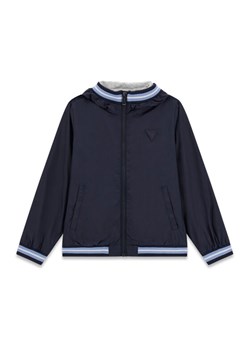 Guess Kids Kurtka przejściowa 180515 Niebieski Classic Fit ze sklepu MODIVO w kategorii Kurtki chłopięce - zdjęcie 188051542