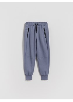 Reserved - Bawełniane spodnie jogger - niebieski ze sklepu Reserved w kategorii Spodnie chłopięce - zdjęcie 188067653