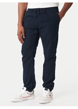 Tommy Jeans Joggery DM0DM23102 Granatowy Regular Fit ze sklepu MODIVO w kategorii Spodnie męskie - zdjęcie 188074522