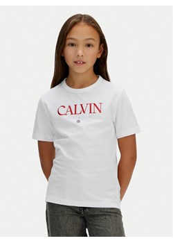 Calvin Klein Jeans T-Shirt IG0IG03060 Biały Regular Fit ze sklepu MODIVO w kategorii Bluzki dziewczęce - zdjęcie 188074703