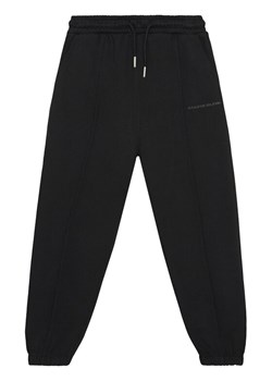 Calvin Klein Jeans Spodnie dresowe Pintuck IB0IB02605 Czarny Relaxed Fit ze sklepu MODIVO w kategorii Spodnie dziewczęce - zdjęcie 188074812