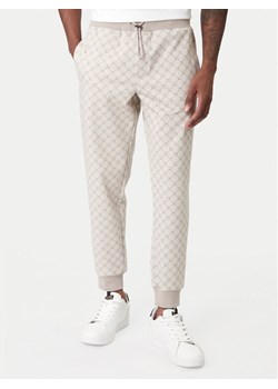 JOOP! Spodnie dresowe Eliton 30100509 Brązowy Regular Fit ze sklepu MODIVO w kategorii Spodnie męskie - zdjęcie 188074911