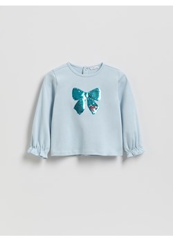 Reserved - Bawełniana bluzka z aplikacją - jasnoniebieski ze sklepu Reserved w kategorii Bluzki dziewczęce - zdjęcie 188091581