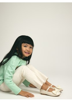 Reserved - Dzianinowe spodnie flare - kremowy ze sklepu Reserved w kategorii Bluzy dziewczęce - zdjęcie 188093844