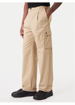 HUGO Spodnie materiałowe Craysen 50553180 Beżowy Straight Fit ze sklepu MODIVO w kategorii Spodnie męskie - zdjęcie 188095591