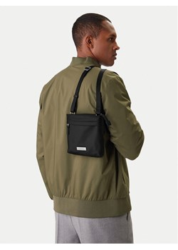 Calvin Klein Saszetka Sleek Slim Flatpack LV04D3234G Czarny ze sklepu MODIVO w kategorii Torby męskie - zdjęcie 188099524