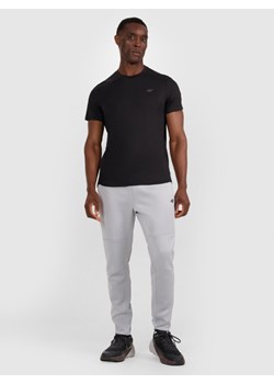 Męskie spodnie treningowe 4F 4FWAW25TFTRM0888 - szare ze sklepu Sportstylestory.com w kategorii Spodnie męskie - zdjęcie 188103353