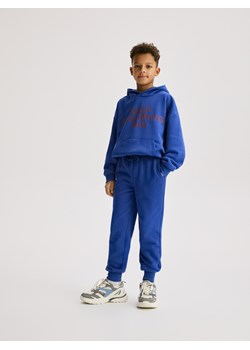 Reserved - Bawełniane spodnie jogger - niebieski ze sklepu Reserved w kategorii Spodnie chłopięce - zdjęcie 188141842