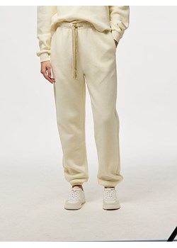 Pieces Spodnie dresowe "Chilli" w kolorze kremowym ze sklepu Limango Polska w kategorii Spodnie damskie - zdjęcie 188314022