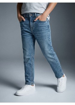 Sinsay - Jeansy slim z efektem sprania - niebieski ze sklepu Sinsay w kategorii Spodnie chłopięce - zdjęcie 188332282