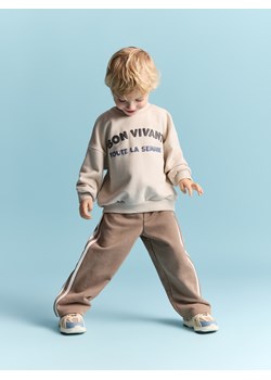 Reserved - Bawełniane spodnie z lampasami - brązowy ze sklepu Reserved w kategorii Spodnie chłopięce - zdjęcie 188357552