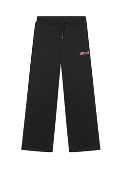 Guess Spodnie dresowe J6RB01 KAD74 Czarny Regular Fit ze sklepu MODIVO w kategorii Spodnie chłopięce - zdjęcie 188359813