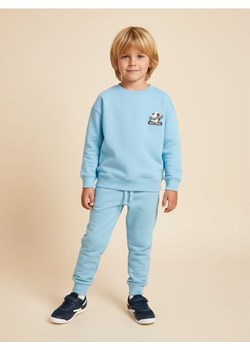 Sinsay - Dresowe spodnie loose - niebieski ze sklepu Sinsay w kategorii Spodnie chłopięce - zdjęcie 188385403