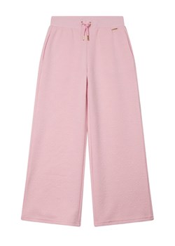 Guess Spodnie dresowe J6RB18 KCHR2 Różowy Regular Fit ze sklepu MODIVO w kategorii Spodnie dziewczęce - zdjęcie 188401494