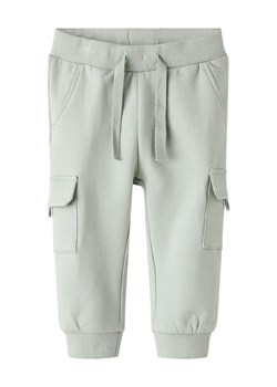 name it Spodnie dresowe "Sanus" w kolorze zielonym ze sklepu Limango Polska w kategorii Spodnie i półśpiochy - zdjęcie 188439262